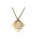 Three brass rings on a white piece necklace