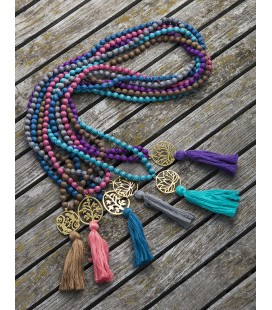 Long silk necklace with a metal piece and a tassel