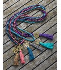 Long silk necklace with a metal piece and a tassel